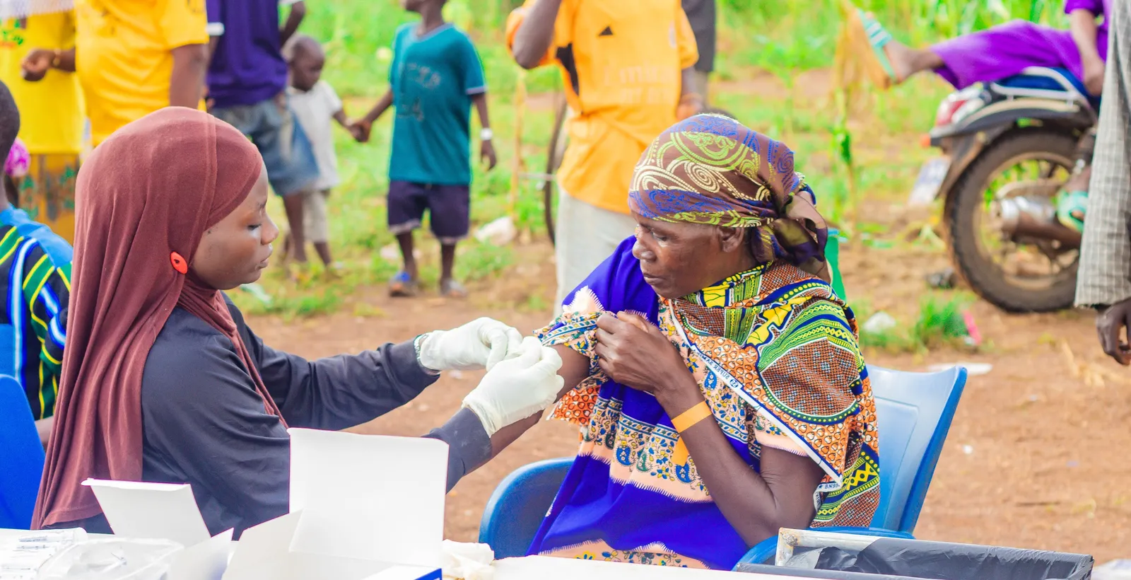 Northern Health Shield health worker caring for a patient in Nalogu, Ghana