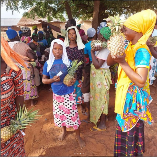 Giving Event - People in Ghana with Pineapple