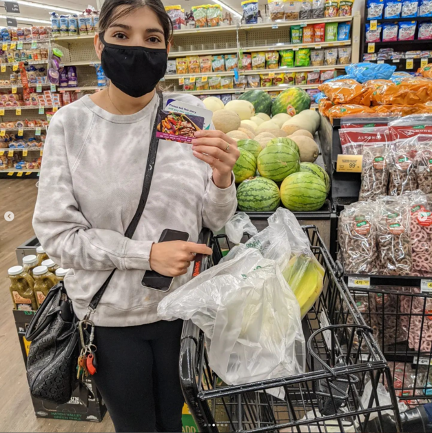 Giving Event - Person Holding Gift Card Smiling