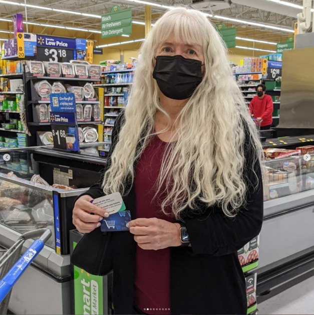 Giving Event - Person Holding Gift Card Smiling