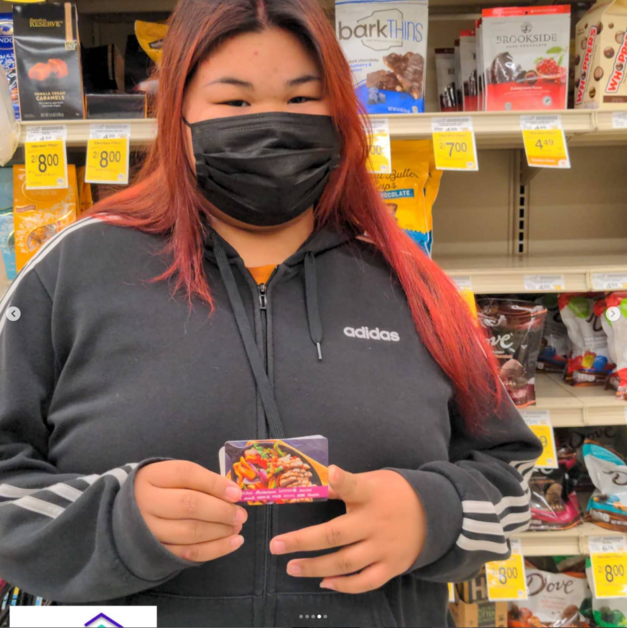 Giving Event - Person Holding Gift Card Smiling