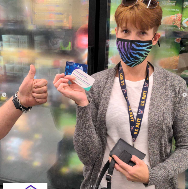 Giving Event - Person Holding Gift Card Smiling