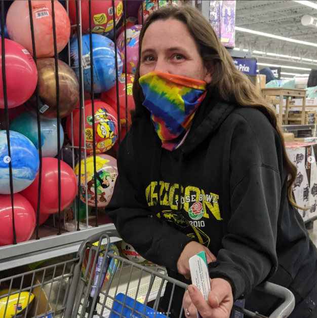 Giving Event - Person Holding Gift Card Smiling