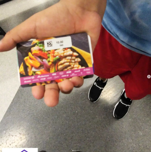 Giving Event - Child Holding Gift Card