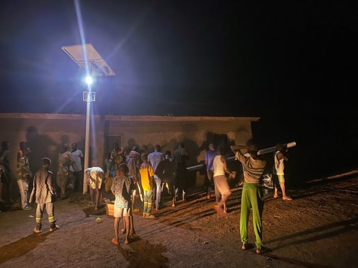 giving event with a solar streetlight in ghana by Give Basic Needs